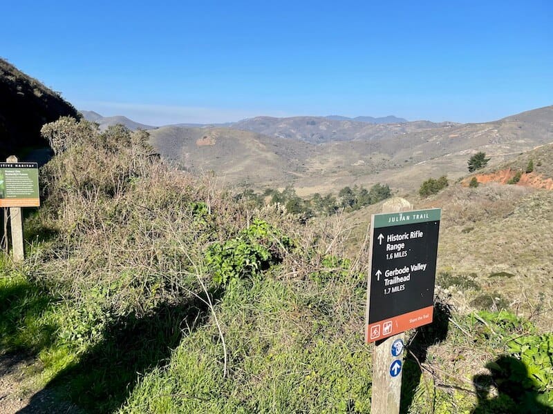 the hiking trailhead at julian trail leading towards black sands beach