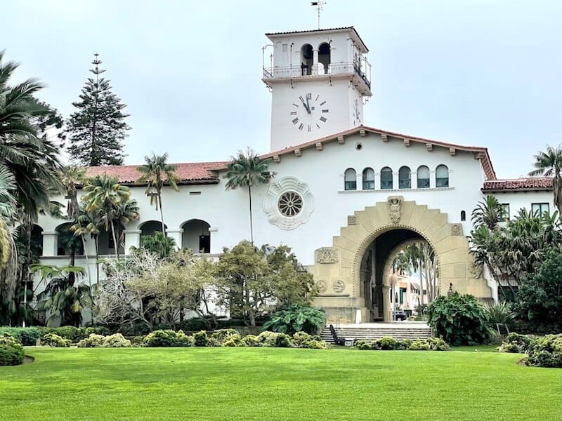 the Santa Barbara courthouse in California with grass garden and lots of plants