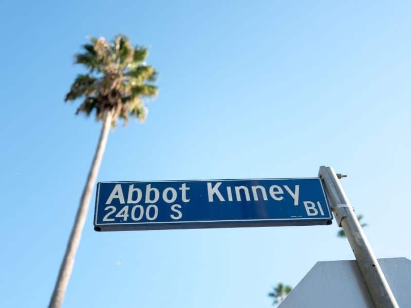 abbott kinney boulevard blue street sign with single palm tree