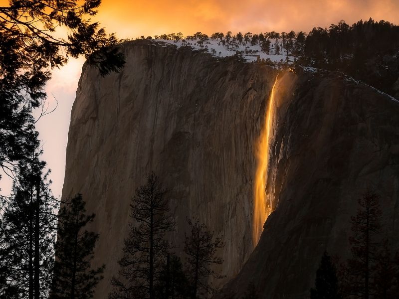 Firefall cascading over the granite cliffs in Yosemite NP