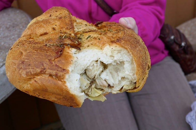 bread stuffed with artichoke heart and topped with herbs