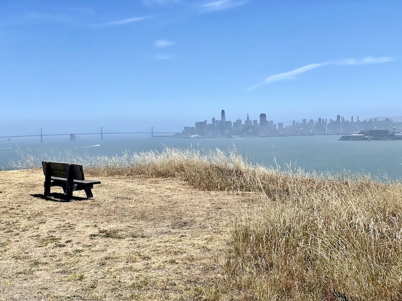 Bench overlooking the Bay bridge, trreasure island, Alcatraz, and the San Francisco skyline on a bike path