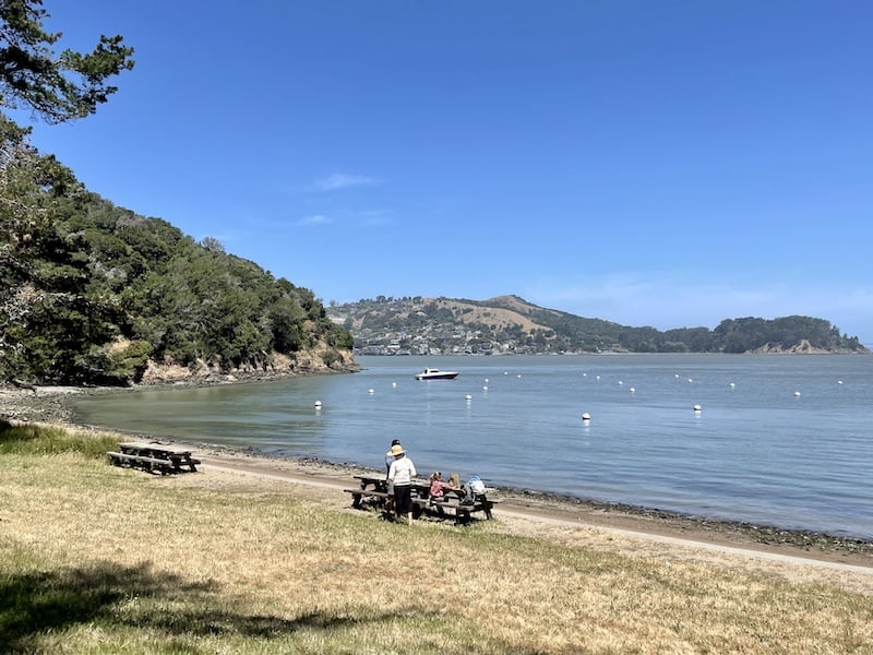 Having a picnic on Angel island picnic tables with a view of the water