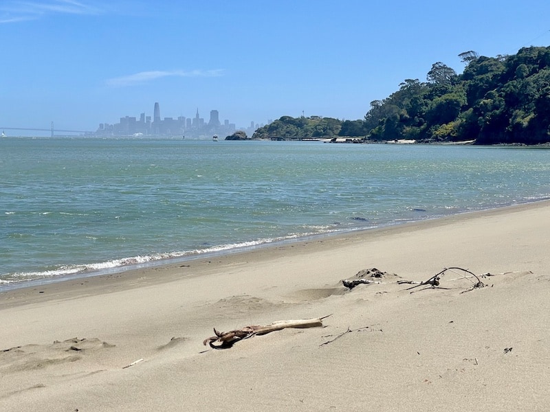 Gorgeous sandy beach on Angel Island with a view of the Bay Bridge and the San Francisco skyline